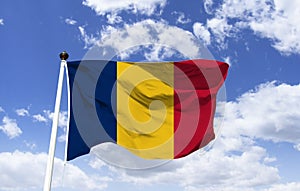 Chad flag mockup fluttering under blue sky. photo