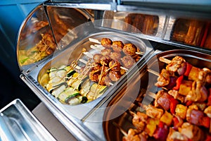 Chafing Dish with assorted grilled meat and vegetables.