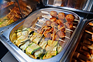 Chafing Dish with assorted grilled meat and vegetables.