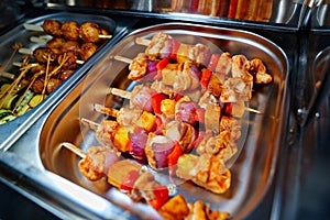 Chafing Dish with assorted grilled meat and vegetables.