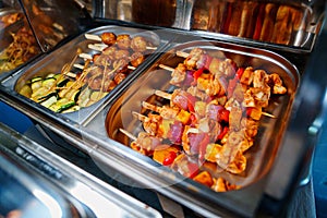 Chafing Dish with assorted grilled meat and vegetables.