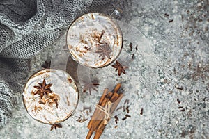 Chai latte and ingredients on concrete background