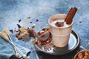 Chai Masala Tea in rustic cup with spices