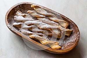 Chai Spiced Russian Twig Sweet Crackers with Powdered Sugar in Wooden Bowl.