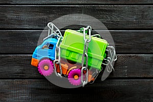 Chain around the truck for car protection concept on wooden background top view