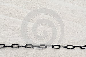Chain on beach sand