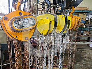 chain block or chain hoist hang and dry after cleaning and oiling. commonly used for lifting in factories