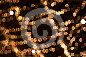 Chain of bokeh lights Christmas background. Festive concept.