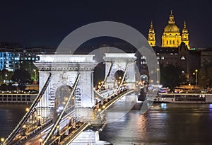 Chain Bridge over Danube river and St. Stephen`s Basilica at night, Budapest, Hungary