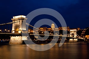 Chain bridge and royal palace at night