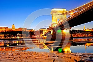 The Chain Bridge at sunset over the icy Danube River, Budapest,