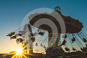 Chain carousel and Ferris wheel at the Munich Oktoberfest