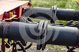 Chain coupler connecting freight wagons, large wagon buffers visible. photo