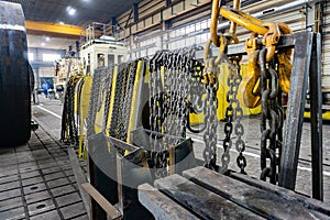 Chain for the crane on the rack, cargo slings for lifting goods photo