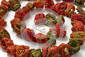 Chain of dried peppers, Biber Kurusu, on white background