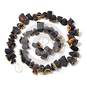 Chain of dried Turkish eggplants on white background