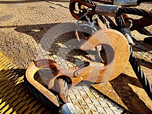 Chain hook of the tower crane for lifting cargo close-up. Rope slings close-up