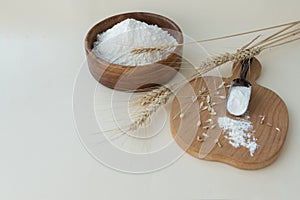 chain of ingredients for making bread: wheat ears, grain, flour on light background