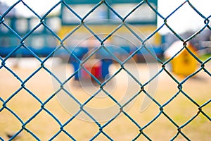Chain-link of blue color close-up, background is blured