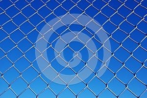 Chain Link Fence Against a Gradient Sky