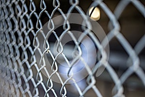 a chain link fence at a baseball dugout field