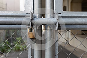 Chain link fence and metal door with lock