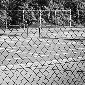 Chain-link Fence with Tennis Court in Background