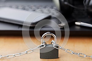 Chain with lock in front of the laptop and smartphone, gadget and digital devices detox concept