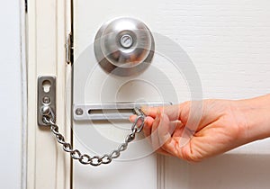 Chain lock and knob lock in door