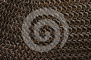 chain mail cloth, steel rings on wood surface
