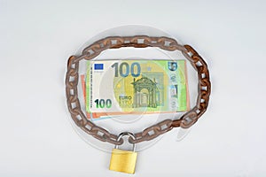 Chain with padlock around  cash money. Safe deposit concept
