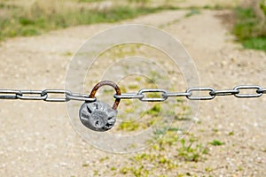 With chain and padlock closed rural country road