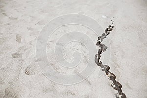 Chain in the sand