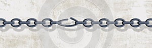 A chain is seen with stretched and broken weak link in this illustration