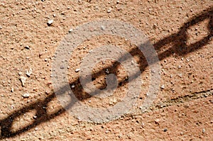 Chain Shadow on brown concrete background