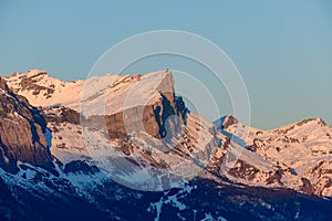 The Chaine des Fiz and its orange colors in Europe, in France, Rhone Alpes, in Savoie, in the Alps, in winter, on a sunny day