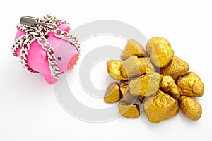 Chained piggy bank and gold