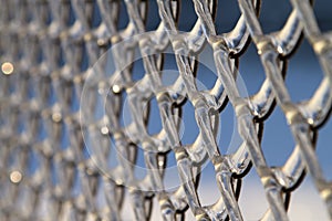 Chainlink fence, covered with ice