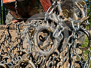 Chains close up on old romanian forestry tractor