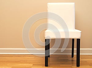 Chair against a beige wall in a home