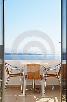 Chair at balcony with sea view