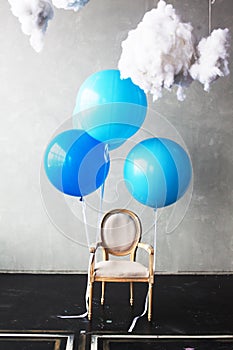 Chair with balls flies into the clouds of dreams happiness