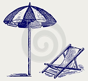 Chair and beach umbrella photo