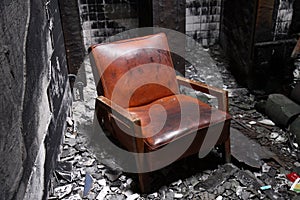 A chair in a burned house