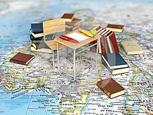 Chair and desk with books on the world map.