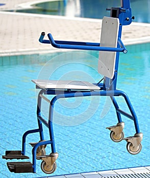 Chair for disabled people to make use of the pool for the handicapped photo