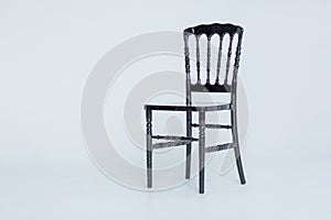 Chair with is an empty white room on a white background