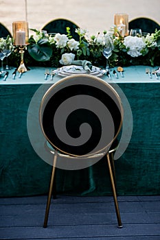 Chair. Flowers. Candles. Wedding decoration. Floral arrangements