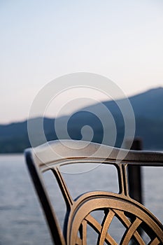 Chair at the lake in sunset