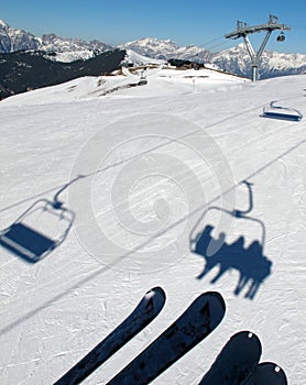 Chair lift shadows on snow